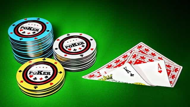 Drawing of poker cards and chips on green background.