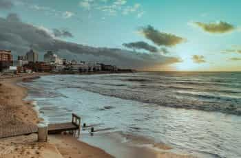 The beach with high rise buildings in the distance, in Punta del Este, Uruguay.